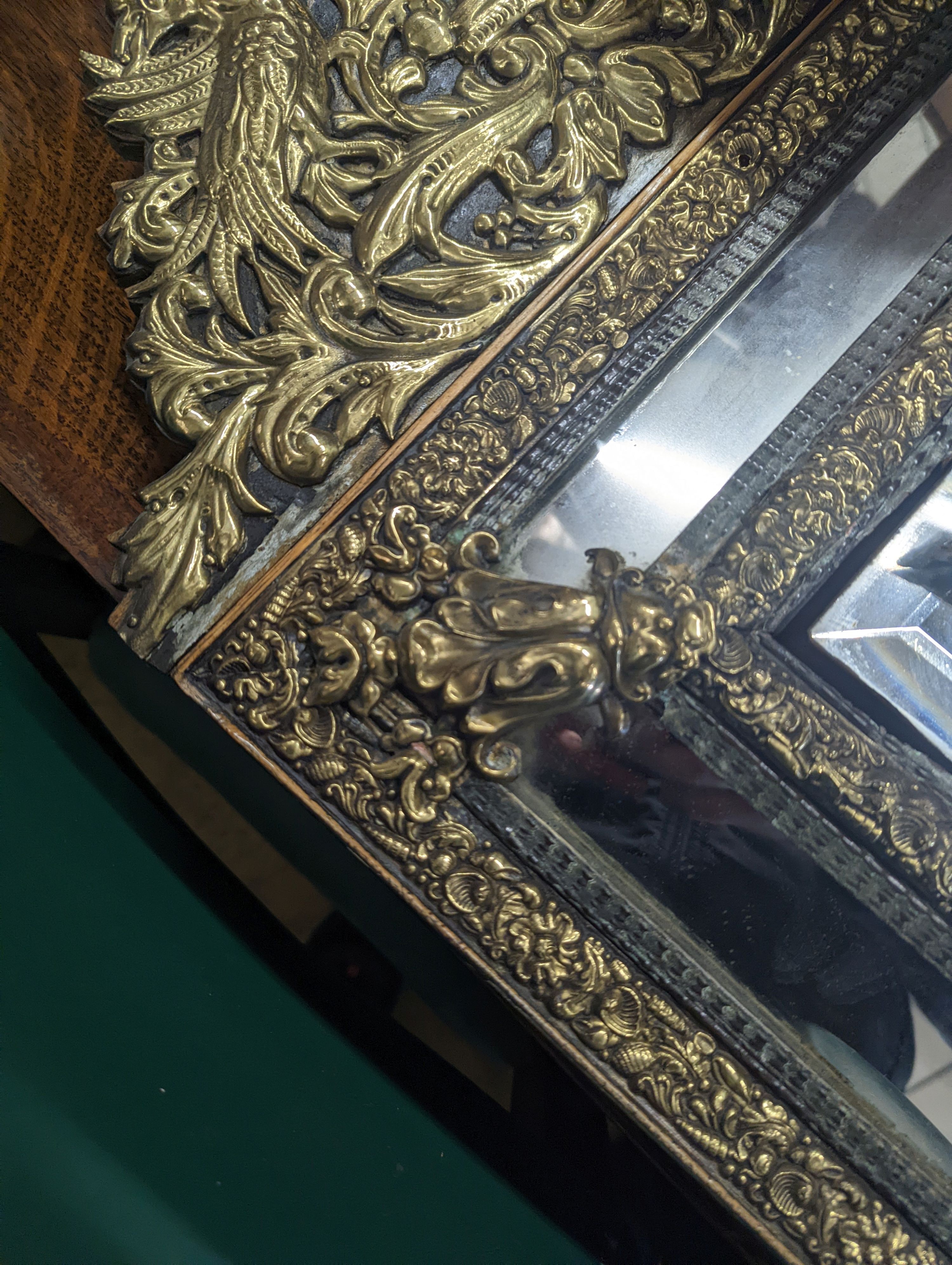 A 19th century Dutch embossed brass wall mirror, width 45cm, height 75cm